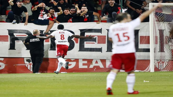 Ajaccio players and fans celebrate